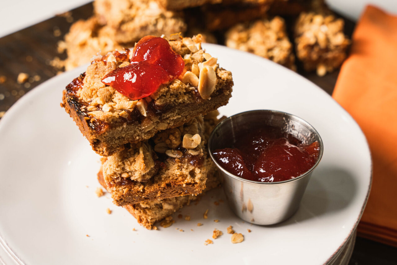 Peanut Butter and Jelly Cookie Bars Sauced by Sunday